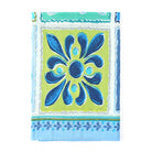 Corner detail of the blue tile print with a leaf border