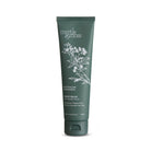 The dark green hand balm tube on its own, with its white botanical drawing.