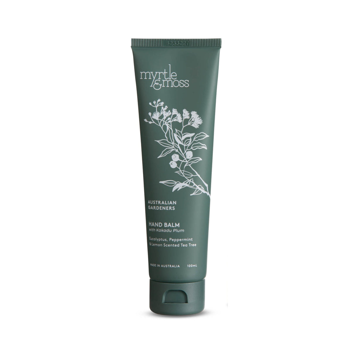 The dark green hand balm tube on its own, with its white botanical drawing.