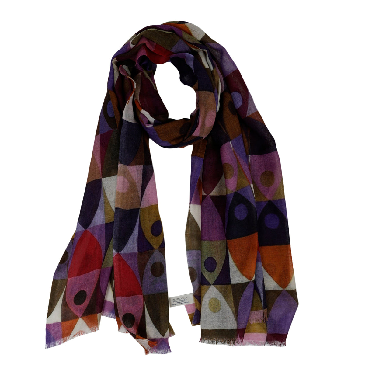 Geometric print wool and silk scarf draped loosely, almond shapes in plum, red, orange and pink