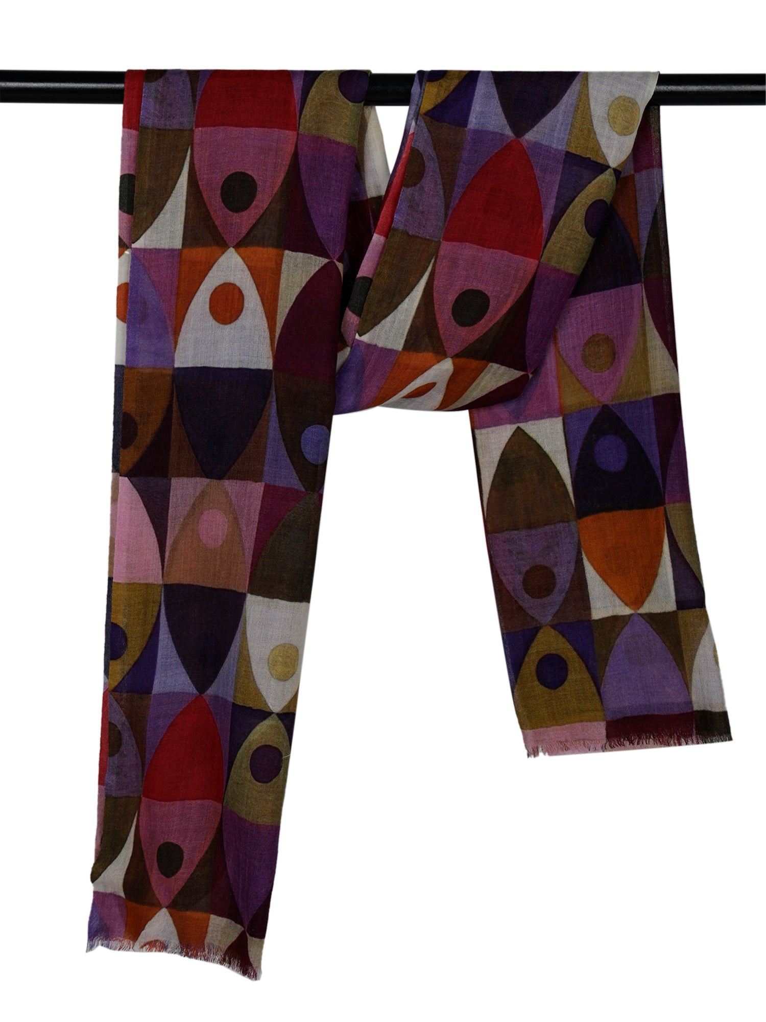 The geometric print scarf hanging over a rail, showing the purple, red and olive shapes
