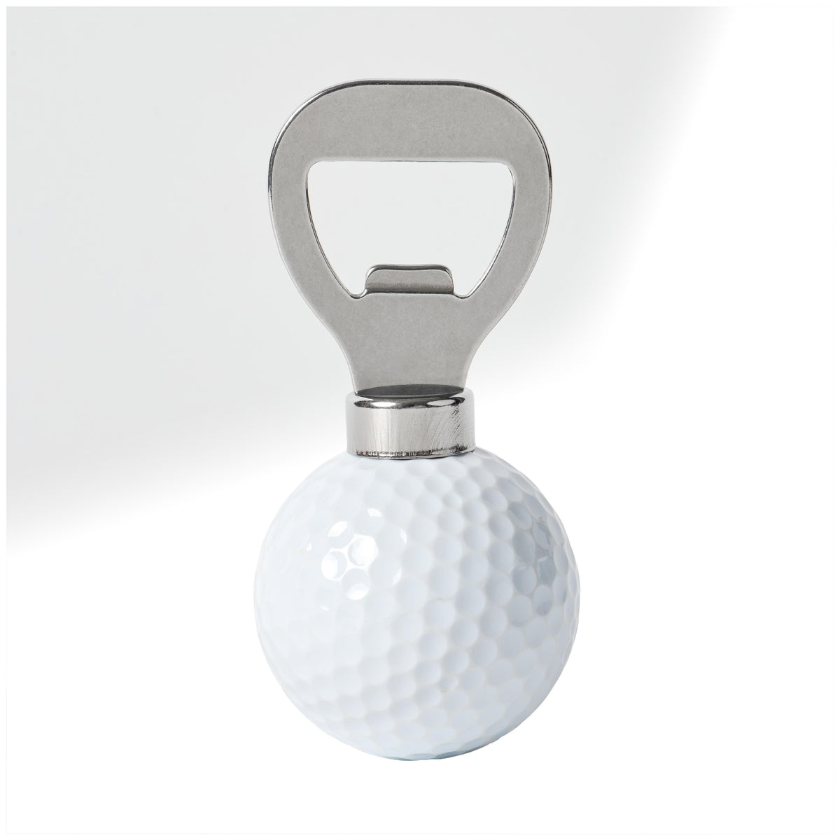 Polished metal bottle opener set into a white dimpled golf ball