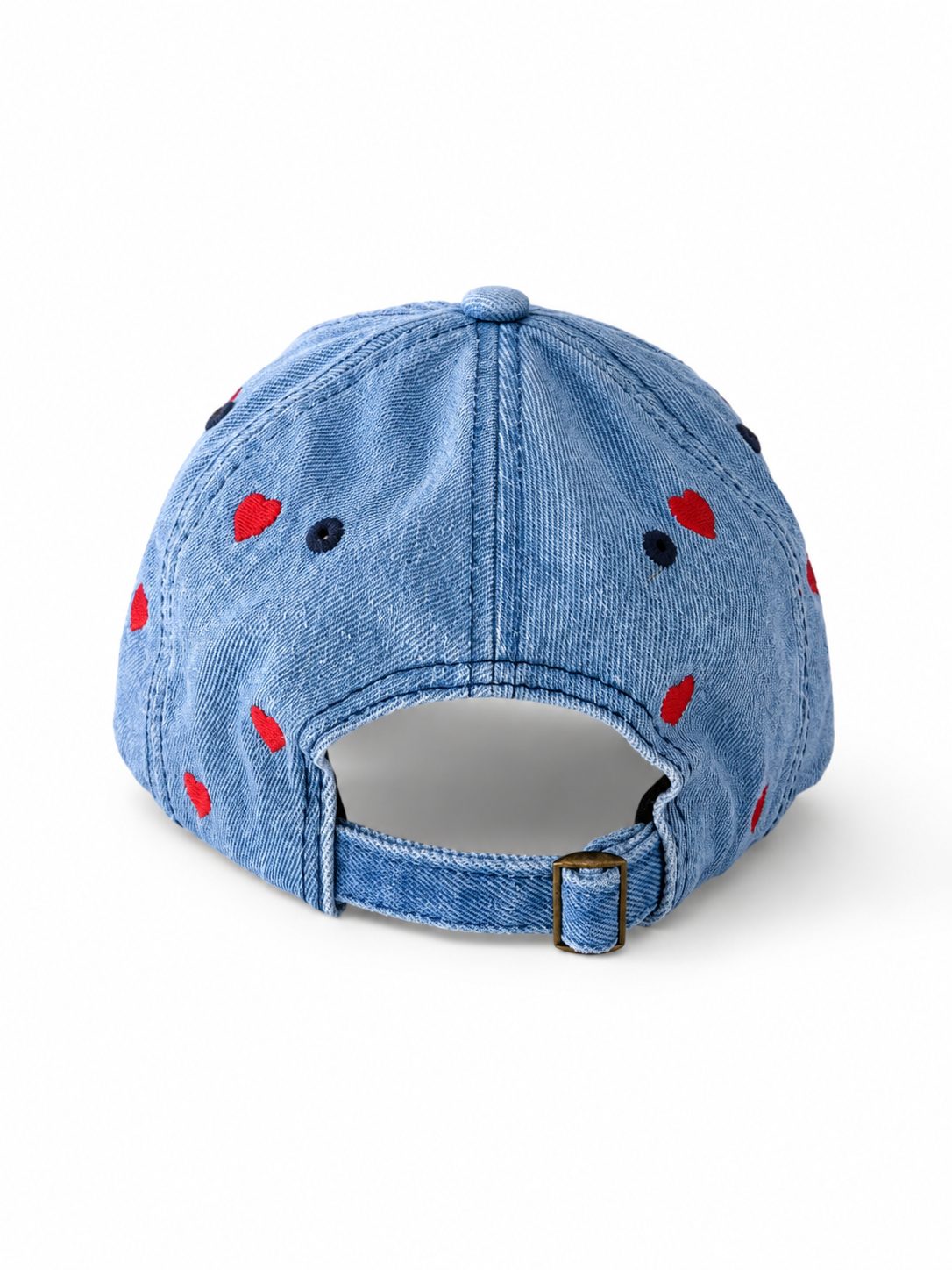Back of the mid-wash denim heart cap, showing the open gap and adjustable metal-buckle strap.