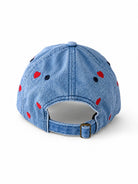 Back of the mid-wash denim heart cap, showing the open gap and adjustable metal-buckle strap.