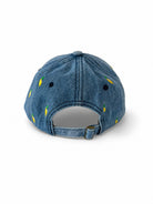 Back of the mid-wash denim lemon cap, showing the open gap and adjustable metal-buckle strap.