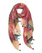 Lightweight scarf in a red and pink patchwork of small floral prints, looped to show the red and green tassels.
