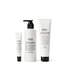The three products inside: a Kakadu Plum lip balm tube, a Tuberose & Grapefruit hand wash pump bottle and a Geranium & Bergamot hand cream tube.