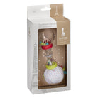 The maracas rattle in its printed retail box, with an Eiffel Tower illustration behind it.