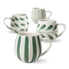 All four Olive Brush mugs on white: two leaf prints, a fine-line pattern and the bold stripe in front.