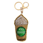 Beaded keyring shaped like a takeaway iced coffee cup with white beaded cream and a green ICED COFFEE label, on a gold-tone clip and ring.