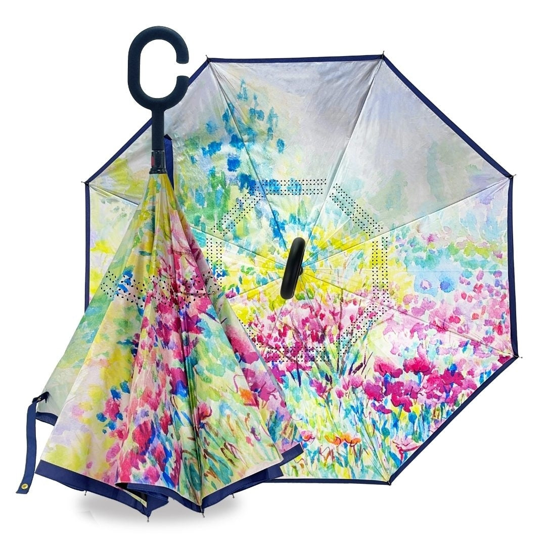 Reverse umbrella with a bright watercolour garden design in blues, greens and pinks