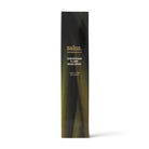 The 125 ml room spray's dark carton, printed with blurred green lemongrass leaves.