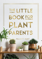 Front cover of The Little Book for Plant Parents by Felicity Hart: gold lettering inside a thin gold frame on white, above cacti and succulents in pots on a wooden shelf