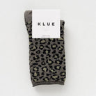 Khaki green leopard print KLUE glitter socks folded in their white branded paper band