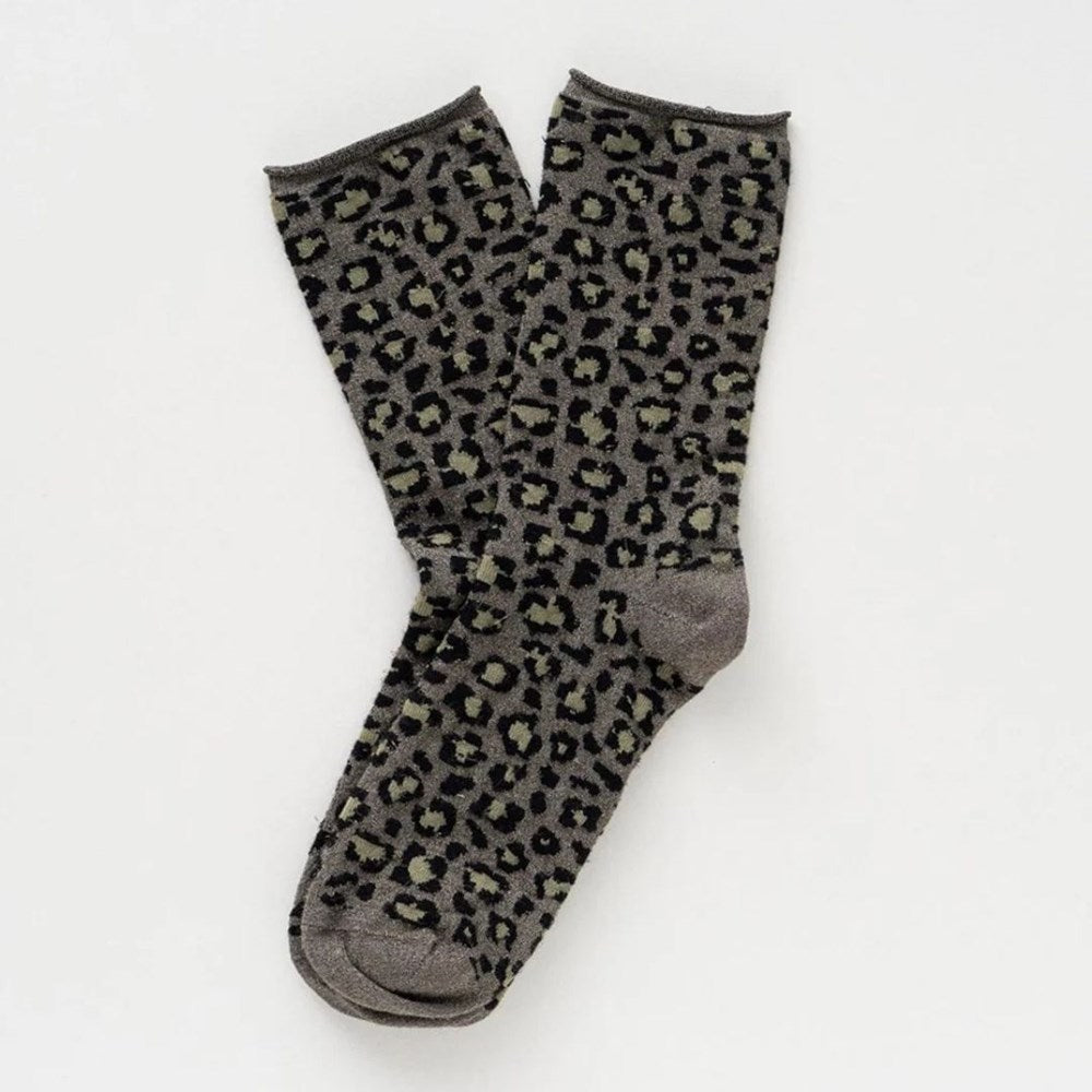 Pair of khaki green leopard print KLUE lurex socks laid flat, showing the plain grey heel and toe