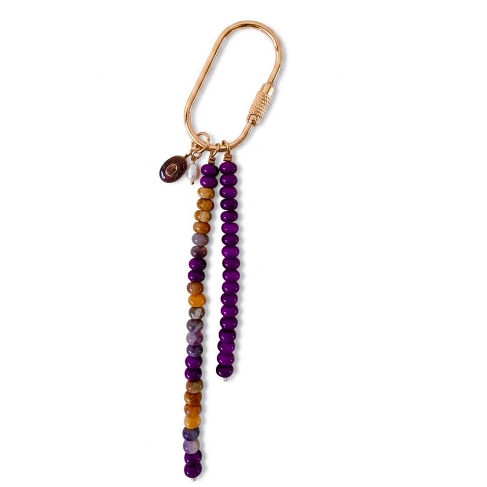 Gold carabiner keyring with a strand of deep purple stone beads and a strand of purple, lilac and honey gold beads