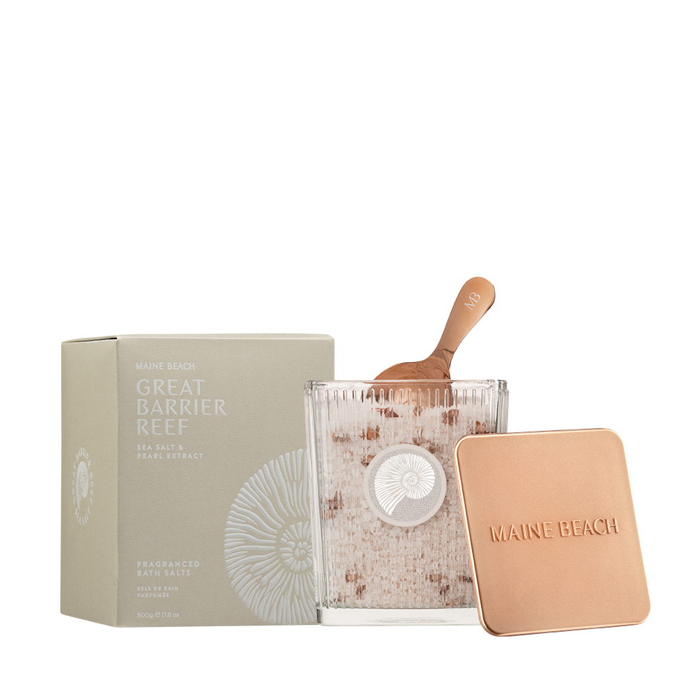Great Barrier Reef Fragranced Bath Salts in a ribbed glass jar with a copper-coloured scoop, beside its copper-coloured lid and box