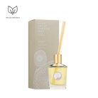 Great Barrier Reef Sea Salt Fragrance Diffuser in a glass bottle with a gold top and reeds, beside its box