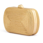 Gold clutch at a three-quarter angle, showing the brushed gold frame along the side