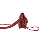 End view of the red wallet, showing its zipped sections and the tab pocket.