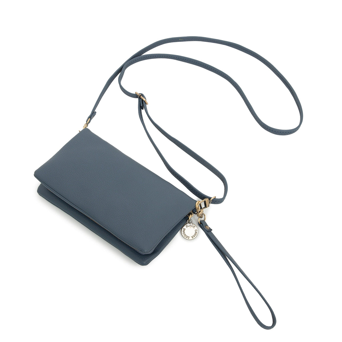 The slate blue wallet at an angle with the long strap and wrist strap attached.