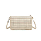 The back of the gold clutch, perforated all over.