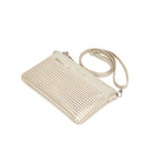 The gold clutch lying flat at an angle, with the long strap looped behind.