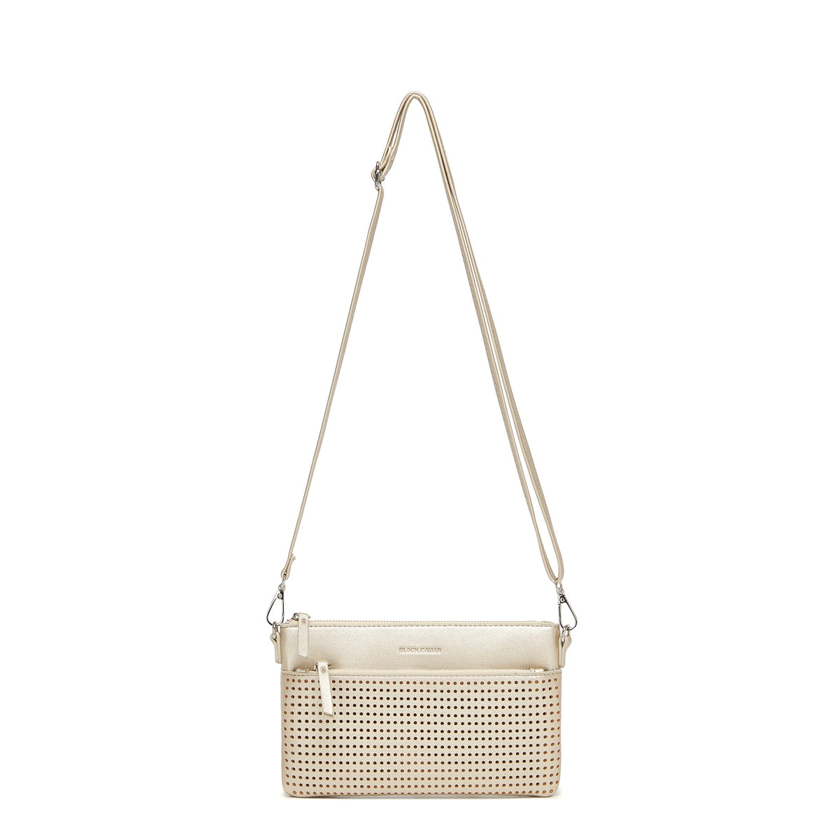 The gold clutch hanging from its long adjustable strap.