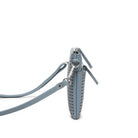 Side view of the blue clutch, showing its slim depth and strap clips.