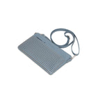 The blue clutch lying flat at an angle, with the long strap looped behind.