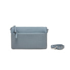 The blue clutch with a strap coiled beside it.