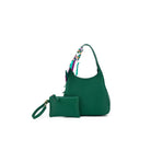 Green top handle bag with a printed scarf tied on its handle, beside its matching green wristlet pouch.