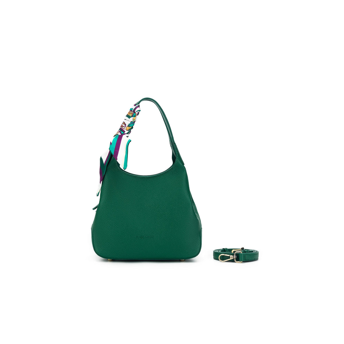 The green bag from the front, its long strap coiled beside it.