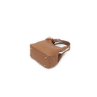 The mocha bag from below, showing four gold-tone feet on its base.