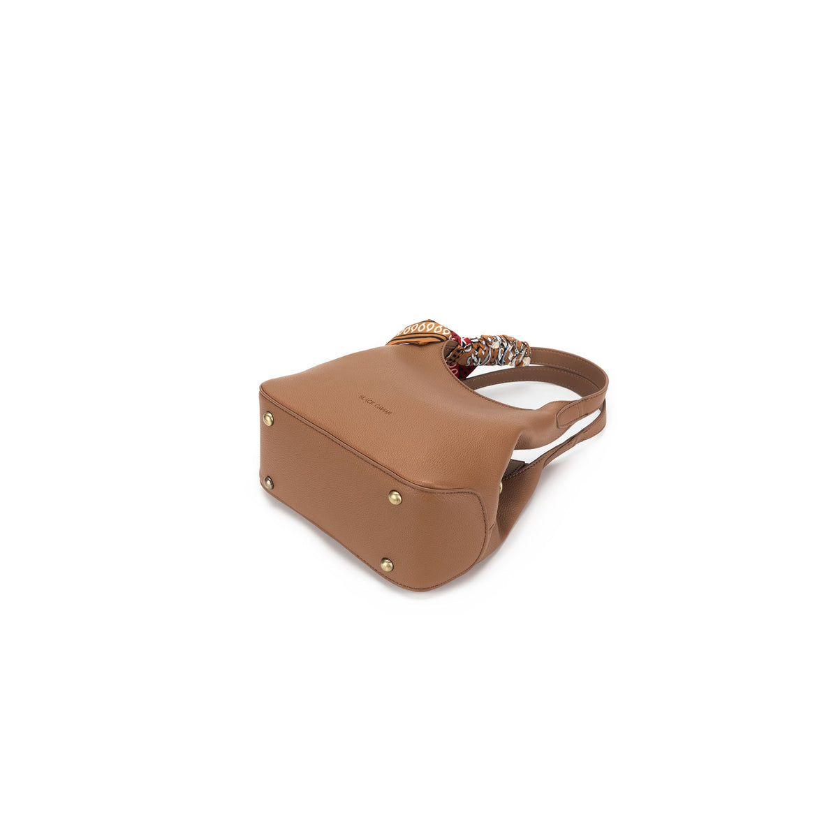 The mocha bag from below, showing four gold-tone feet on its base.