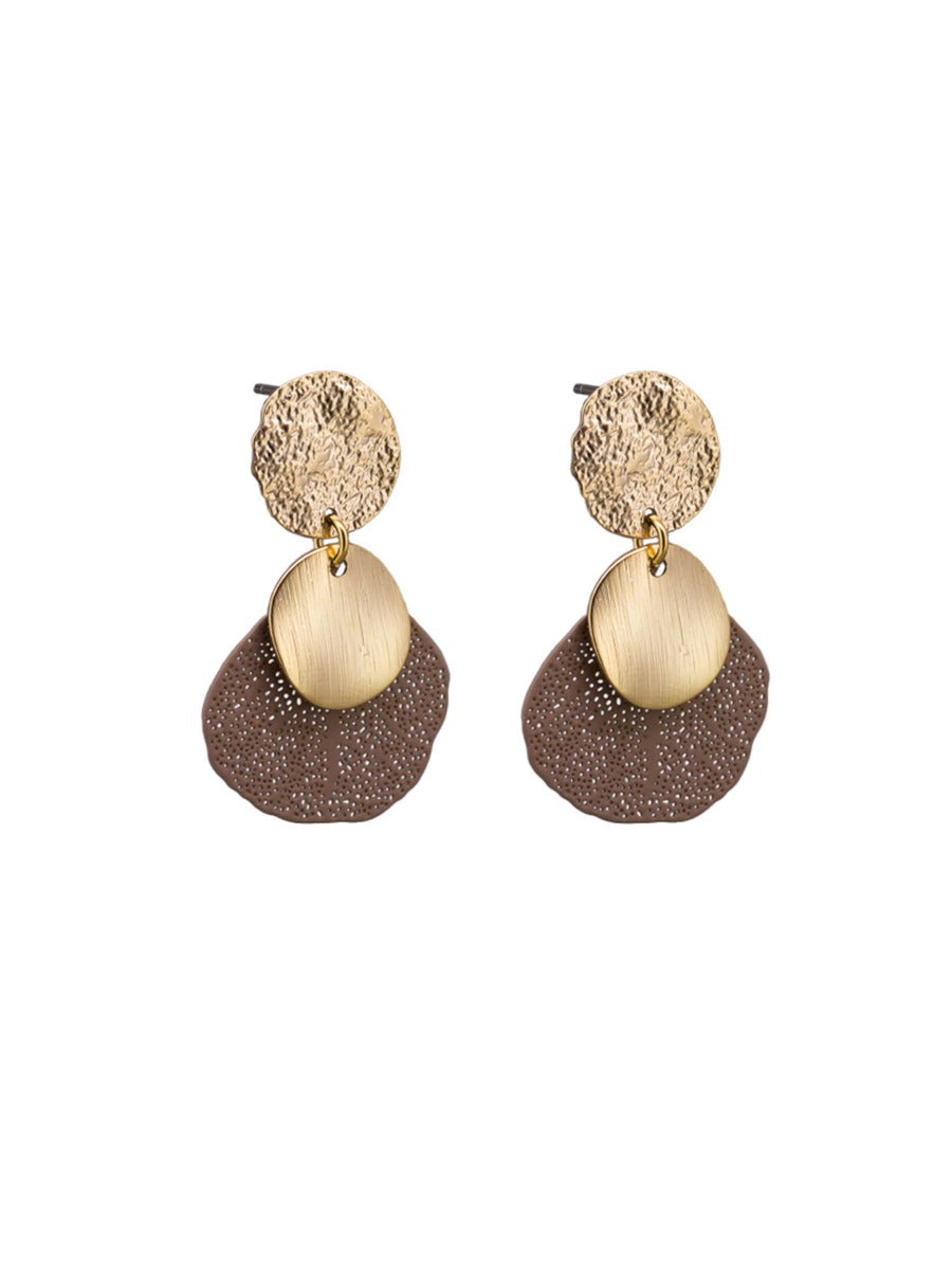 Pair of drop earrings with a hammered gold-tone disc, a brushed gold-tone oval and a matte mocha leaf pierced with tiny holes