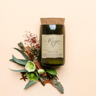 Cedar & Saffron candle on apricot with eucalyptus, driftwood, red berries and star anise