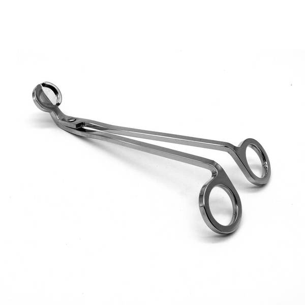 Silver stainless wick trimmer on a cream background