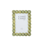 Rectangular photo frame with a border of glossy forest green lucite bubbles around a 4x6 photo opening.