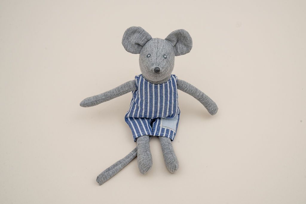 Grey mouse in blue and white striped overalls, with long arms, legs and tail.