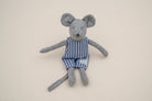 Grey mouse in blue and white striped overalls, with long arms, legs and tail.
