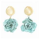 Drop earrings with a textured gold-tone disc stud and an aqua dried rose bud