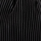 Close-up of the fine black pleats