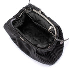 The clutch open wide on its gunmetal frame, showing a black patterned lining
