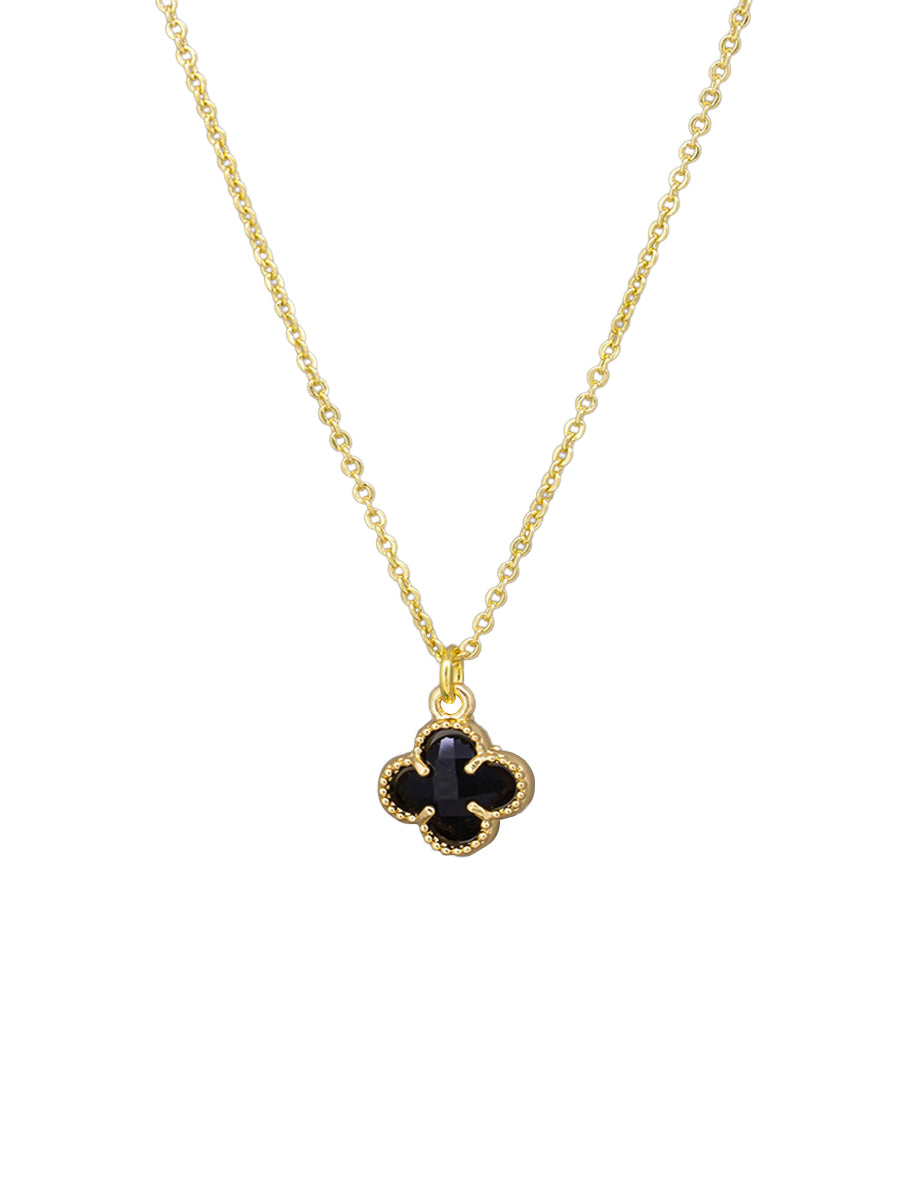 Gold Felice necklace with a black clover pendant on a fine chain