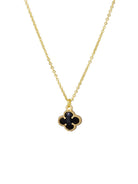 Gold Felice necklace with a black clover pendant on a fine chain