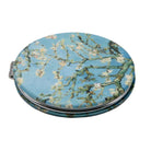 Folding pocket mirror covered in Van Gogh's Almond Blossom: white blossom on branches against pale blue.