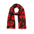 Poppy Bloom cotton modal scarf draped, red poppies on a navy-black ground