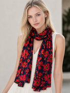 Poppy Bloom cotton modal scarf worn draped around the neck over a white top