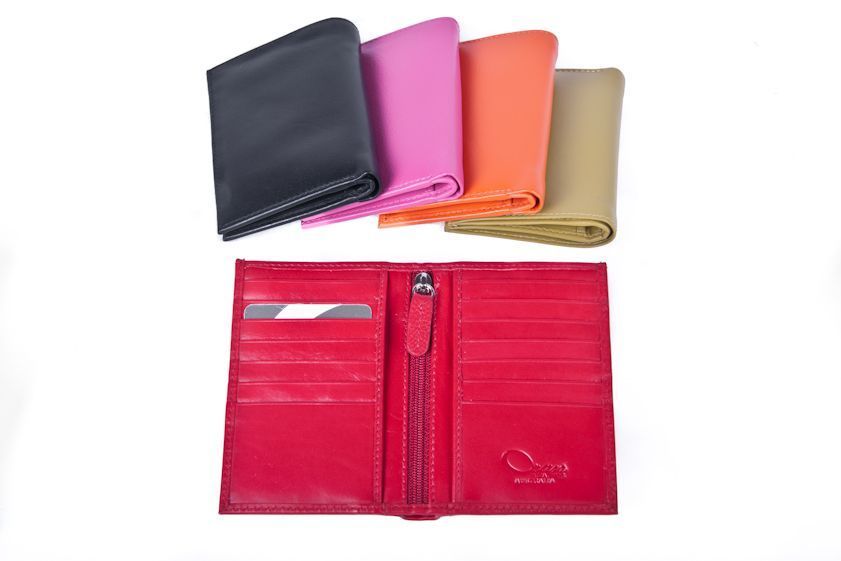 Closed card holders in black, pink, orange and cream, with an open red pair below